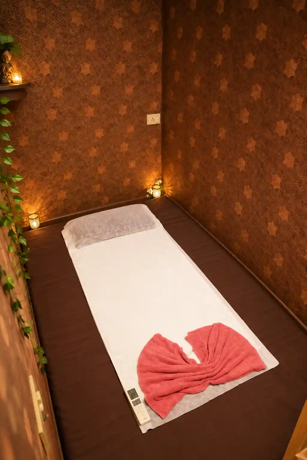 Candle-lit treatment room with floor mattress