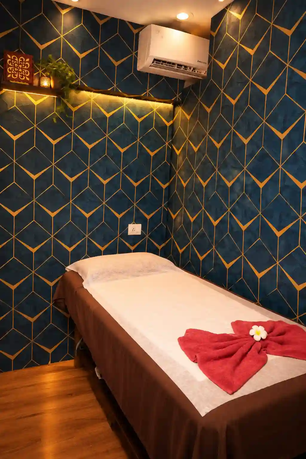 Private massage room with blue and gold walls